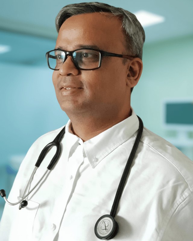 Dr. Saurabh Bhatia, wearing a white shirt and stethoscope